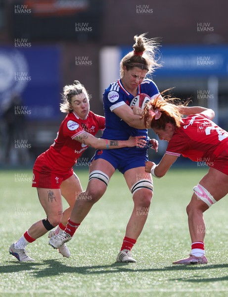 180426 - Wales v France, Guinness Women’s 6 Nations - Lea Champon of France is tackled by Keira Bevan of Wales and Georgia Evans of Wales