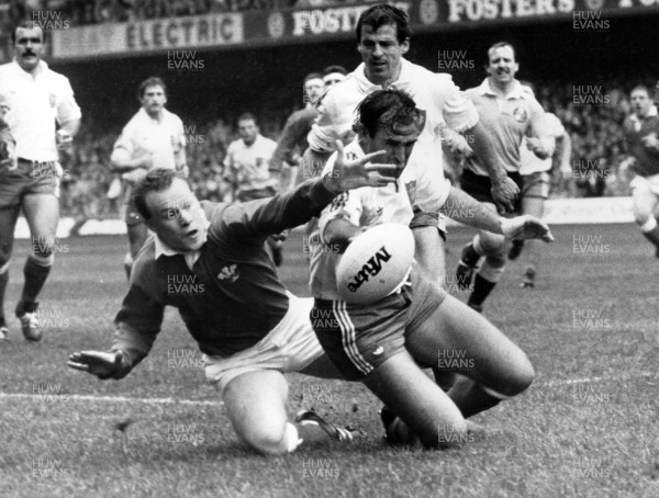 190388 - Wales 9 v 10 France - Five Nations - Paul Thorburn of Wales loses the race for the ball to Jean-Patrick Lescarboura of France