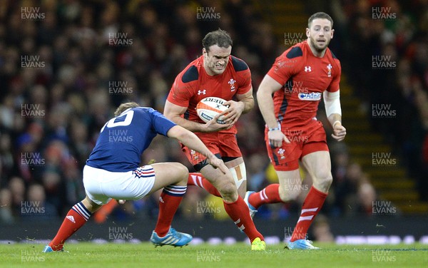 210214 - Wales v France - RBS 6 Nations 2014 -Jamie Roberts of Wales takes on Jules Plisson of France