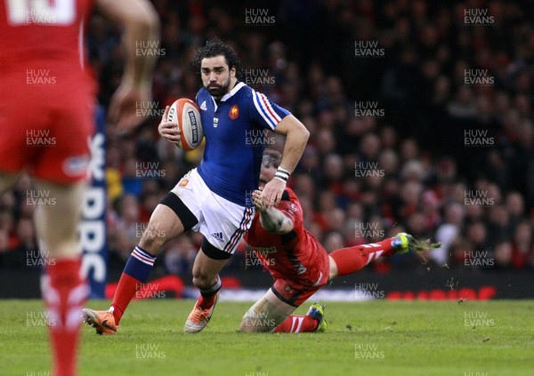 210214 Wales v France - RBS 6 Nations -Yoann Huget of France is tackled by Jamie Roberts of Wales