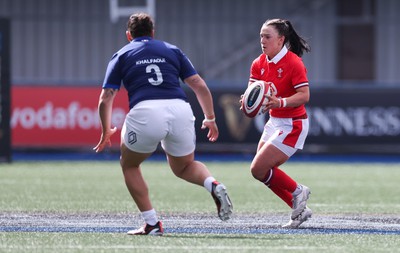 210424 - Wales v France, Guinness Women’s 6 Nations - Sian Jones of Wales takes on Assia Khalfaoui of France