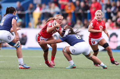 210424 - Wales v France, Guinness Women’s 6 Nations - Georgia Evans of Wales takes on Teani Feleu of France