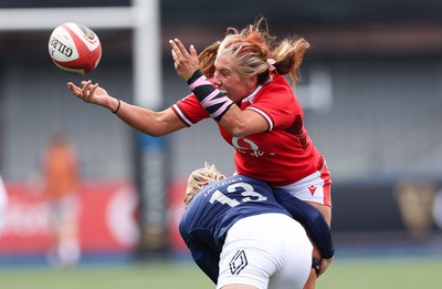 210424 - Wales v France, Guinness Women’s 6 Nations - Georgia Evans of Wales is tackled by Chloe Jacquet of France