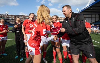 210424 - Wales v France, Guinness Women’s 6 Nations - Ioan Cunningham, Wales Women head coach, presents Catherine Richards of Wales with her first cap at the end of the match