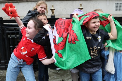 210424 - Wales v France, Guinness Women’s 6 Nations - Wales fans wait for the team to make their way from the hotel to the stadium