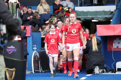 210424 - Wales v France, Guinness Women’s 6 Nations - Hannah Jones of Wales leads her team out to line up for the anthems