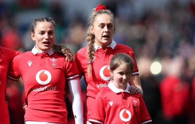 210424 - Wales v France, Guinness Women’s 6 Nations - Jasmine Joyce of Wales and Hannah Jones of Wales with the match day mascot line up for the anthems