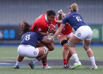 210424 - Wales v France, Guinness Women’s 6 Nations - Sisilia Tuipulotu of Wales takes on Teani Feleu of France and Romane Menager of France