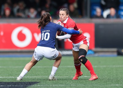 210424 - Wales v France, Guinness Women’s 6 Nations - Jasmine Joyce of Wales takes on Lina Queyroi of France