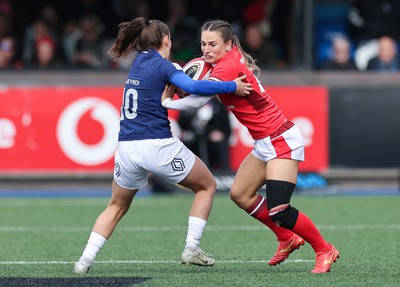 210424 - Wales v France, Guinness Women’s 6 Nations - Jasmine Joyce of Wales takes on Lina Queyroi of France