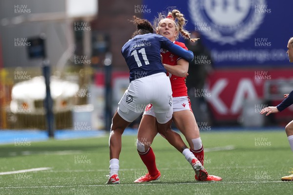 210424 - Wales v France, Guinness Women’s 6 Nations - Hannah Jones of Wales is tackled by Anne-Cecile Ciofani of France
