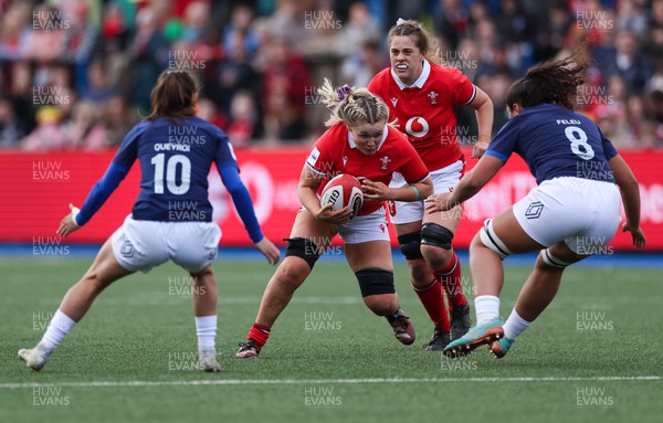 210424 - Wales v France, Guinness Women’s 6 Nations - Alex Callender of Wales takes on Teani Feleu of France and Lina Queyroi of France