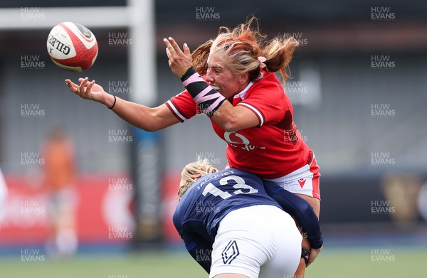 210424 - Wales v France, Guinness Women’s 6 Nations - Georgia Evans of Wales is tackled by Chloe Jacquet of France