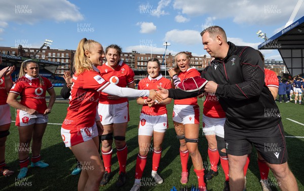 210424 - Wales v France, Guinness Women’s 6 Nations - Ioan Cunningham, Wales Women head coach, presents Catherine Richards of Wales with her first cap at the end of the match