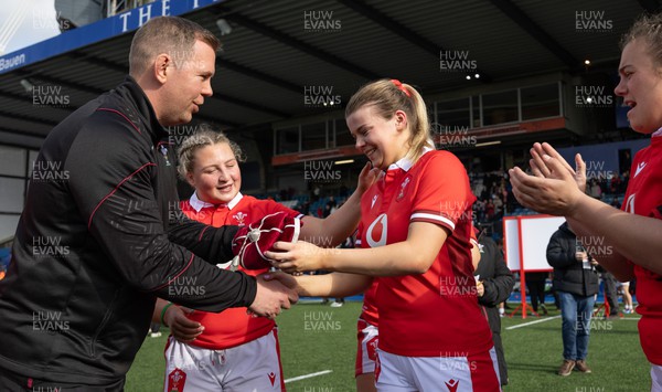 210424 - Wales v France, Guinness Women’s 6 Nations - Ioan Cunningham, Wales Women head coach, presents Mollie Wilkinson of Wales with her first cap at the end of the match