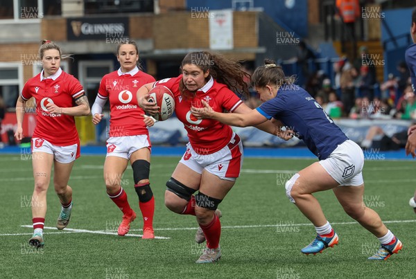 210424 - Wales v France, Guinness Women’s 6 Nations - Gwennan Hopkins of Wales takes on Agathe Sochat of France