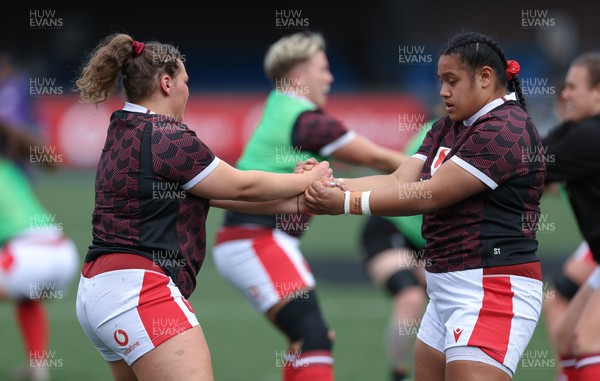 210424 - Wales v France, Guinness Women’s 6 Nations - Gwenllian Pyrs of Wales and Sisilia Tuipulotu of Wales during warm up