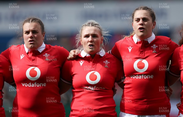 210424 - Wales v France, Guinness Women’s 6 Nations - Carys Phillips of Wales, Alex Callender of Wales and Natalia John of Wales line up for the anthems