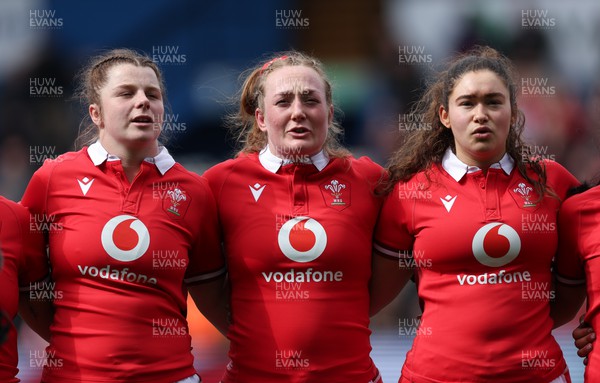 210424 - Wales v France, Guinness Women’s 6 Nations - Kate Williams of Wales, Abbie Fleming of Wales and Gwennan Hopkins of Wales line up for the anthems