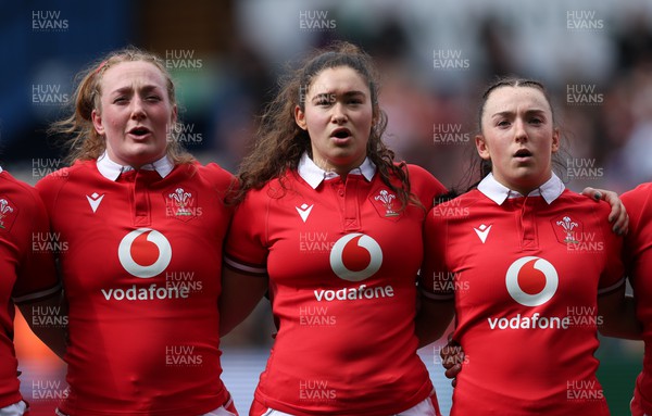 210424 - Wales v France, Guinness Women’s 6 Nations - Abbie Fleming of Wales , Gwennan Hopkins of Wales and Sian Jones of Wales line up for the anthems