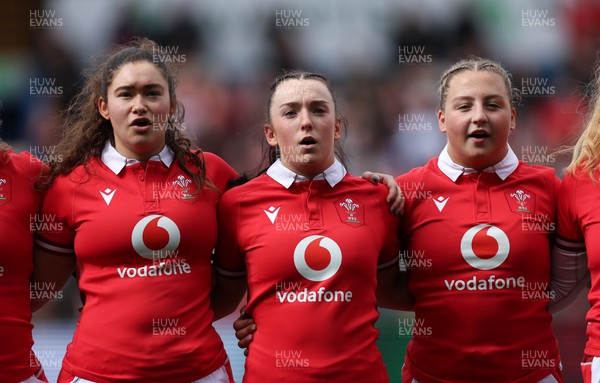 210424 - Wales v France, Guinness Women’s 6 Nations - Gwennan Hopkins of Wales, Sian Jones of Wales and Molly Reardon of Wales line up for the anthems