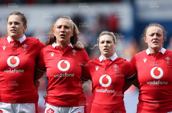 210424 - Wales v France, Guinness Women’s 6 Nations - Natalia John of Wales, Georgia Evans of Wales, Keira Bevan of Wales and Lleucu George of Wales line up for the anthems