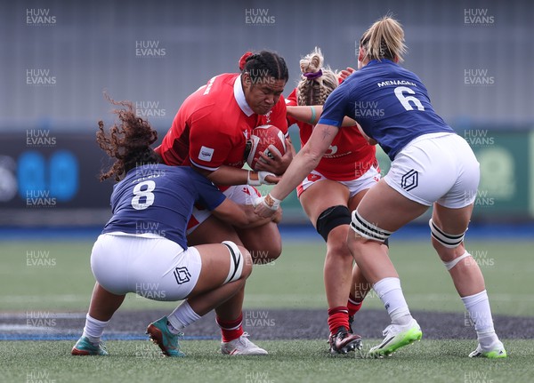 210424 - Wales v France, Guinness Women’s 6 Nations - Sisilia Tuipulotu of Wales takes on Teani Feleu of France and Romane Menager of France