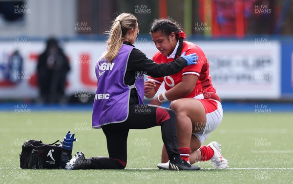 210424 - Wales v France, Guinness Women’s 6 Nations - Sisilia Tuipulotu of Wales receives treatment from Cara Jones, physio