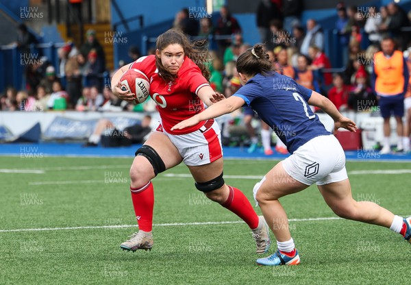 210424 - Wales v France, Guinness Women’s 6 Nations - Gwennan Hopkins of Wales takes on Agathe Sochat of France