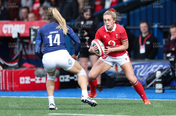 210424 - Wales v France, Guinness Women’s 6 Nations - Hannah Jones of Wales takes on Joanna Grisez of France
