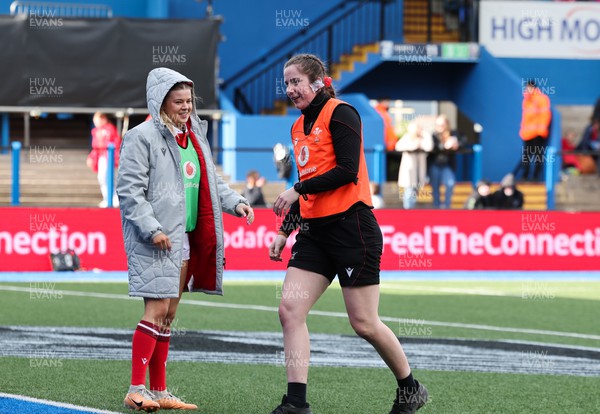 210424 - Wales v France, Guinness Women’s 6 Nations - Lois Drummie works with Mollie Wilkinson of Wales