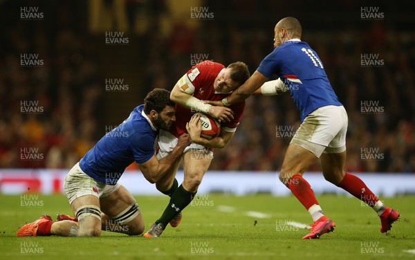 220220 - Wales v France - Guinness 6 Nations - Hadleigh Parkes of Wales is tackled by Charles Ollivon and Gael Fickou of France
