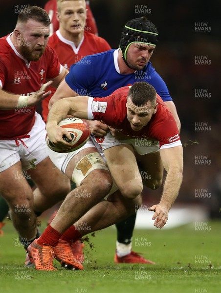 220220 - Wales v France - Guinness 6 Nations - Gareth Davies of Wales is tackled by Gregory Alldritt of France