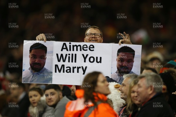 220220 - Wales v France - Guinness 6 Nations - A man holds up a will you marry me sign during the game
