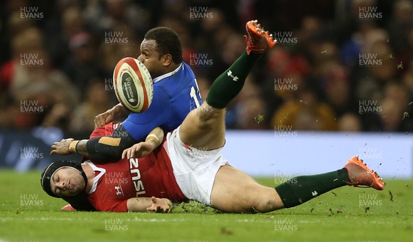 220220 - Wales v France - Guinness 6 Nations - Virimi Vakatawa of France knocks the ball out of Leigh Halfpenny of Wales hand as he tackles him