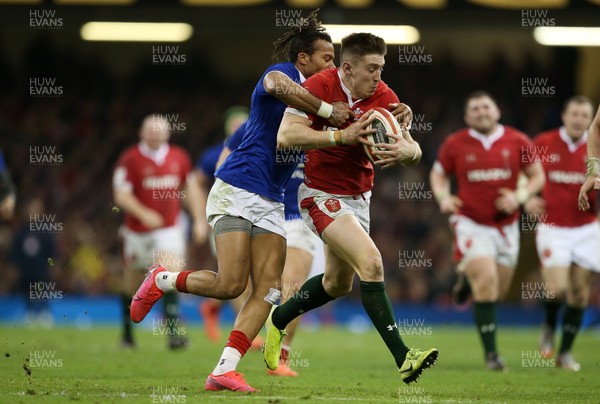 220220 - Wales v France - Guinness 6 Nations - Josh Adams of Wales is tackled by Teddy Thomas of France
