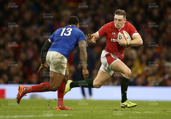 220220 - Wales v France - Guinness 6 Nations - Josh Adams of Wales is tackled by Virimi Vakatawa of France