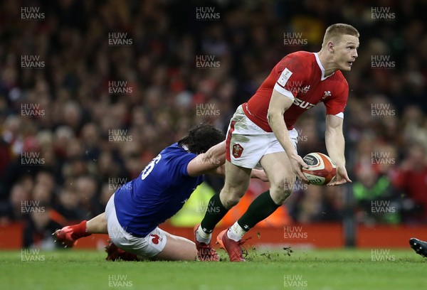 220220 - Wales v France - Guinness 6 Nations - Johnny McNicholl of Wales is tackled by Camille Chat of France