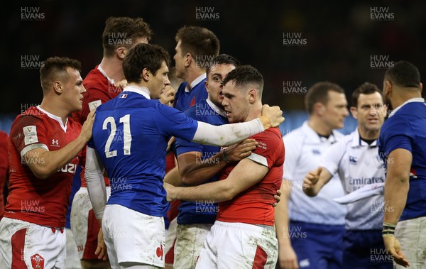 220220 - Wales v France - Guinness 6 Nations - Baptiste Serin of France and Tomos Williams of Wales have words at full time