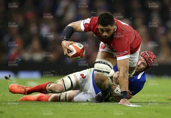 220220 - Wales v France - Guinness 6 Nations - Taulupe Faletau of Wales is tackled by Bernard Le Roux of France