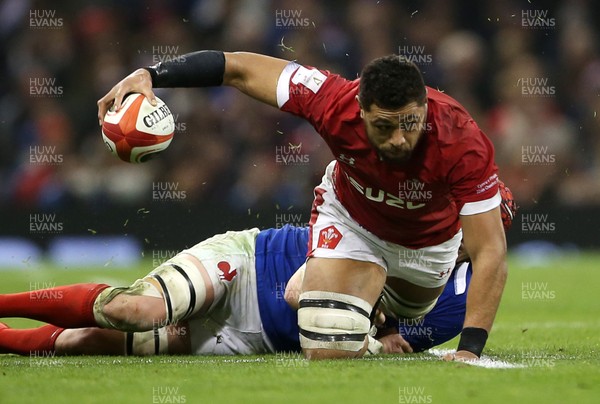 220220 - Wales v France - Guinness 6 Nations - Taulupe Faletau of Wales is tackled by Bernard Le Roux of France