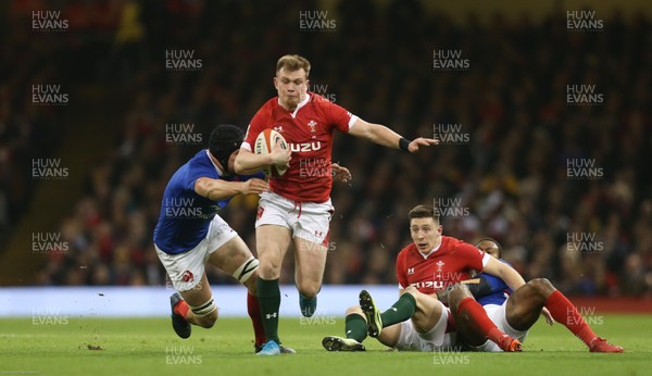 220220 - Wales v France, Guinness Six Nations Championship 2020 - Nick Tompkins of Wales  is tackled by Francois Cros of France