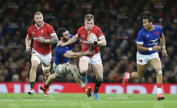 220220 - Wales v France, Guinness Six Nations Championship 2020 - Nick Tompkins of Wales  gets away from Charles Ollivon of France