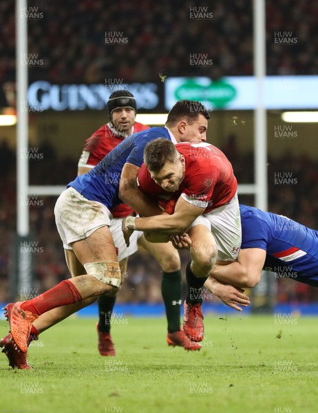 220220 - Wales v France, Guinness Six Nations Championship 2020 - Dan Biggar of Wales is tackled by Julien Marchand of France and Arthur Vincent of France