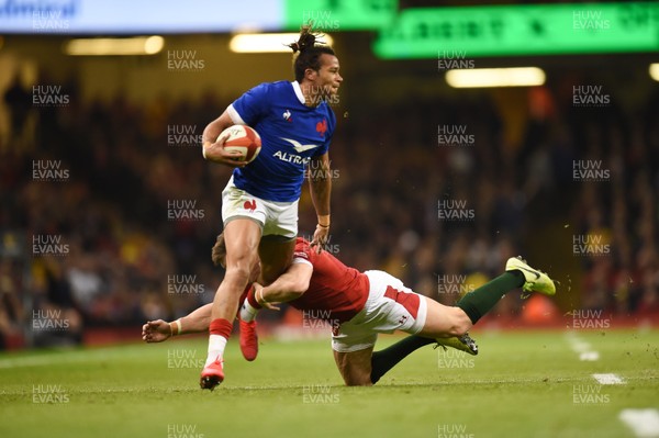 220220 - Wales v France - Guinness Six Nations - Teddy Thomas of France  is tackled by Josh Adams of Wales  