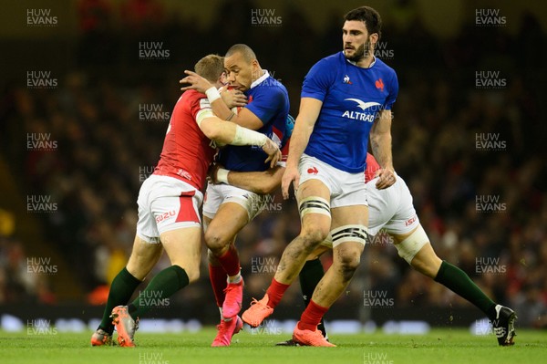 220220 - Wales v France - Guinness Six Nations - Gael Fickou of France is tackled by Hadleigh Parkes of Wales  