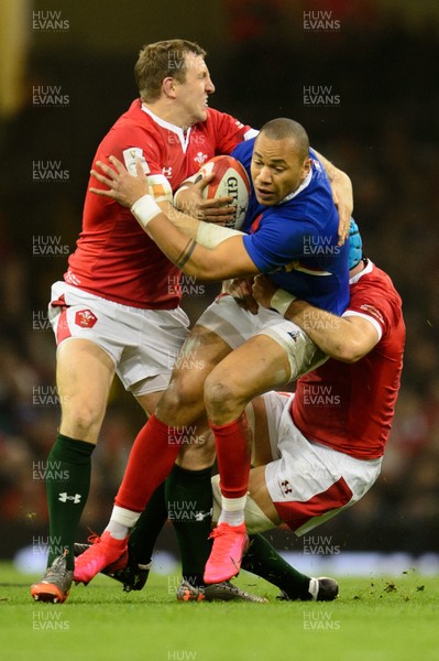 220220 - Wales v France - Guinness Six Nations - Gael Fickou of France is tackled by Hadleigh Parkes of Wales and Justin Tipuric of Wales  