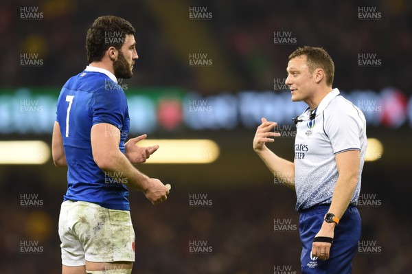 220220 - Wales v France - Guinness Six Nations - Charles Ollivon of France talks to Referee Matthew Carley  