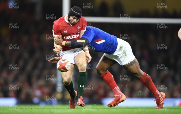 220220 - Wales v France - Guinness Six Nations - Leigh Halfpenny of Wales is tackled by Virimi Vakatawa of France 