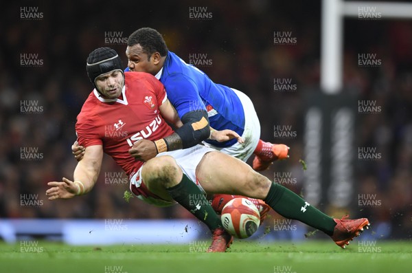 220220 - Wales v France - Guinness Six Nations - Leigh Halfpenny of Wales is tackled by Virimi Vakatawa of France 